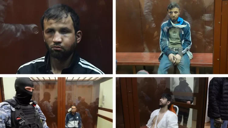 Patru suspecți în cazul atacului asupra sălii de concerte din Rusia au fost arestați, sub acuzația de terorism. Aduși cu ochii vineți și fețele tumefiate în sala de judecată